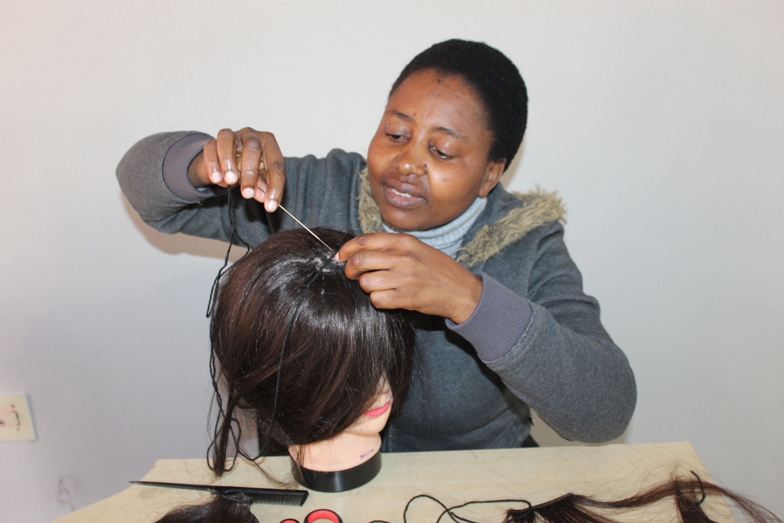 Wig-making lessons at Outreach Foundation