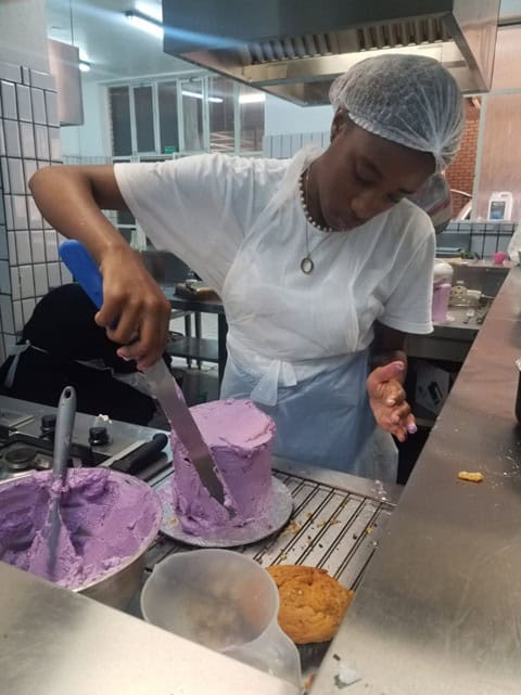 Elizabeth Ngamiso in Outreach Foundation's baking class